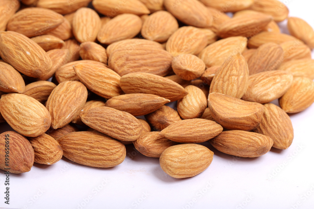 Almonds isolated. Group of almond nuts isolated on white background. Full depth of field Almonds isolated. Group of almond nuts isolated on white background. Full depth of field