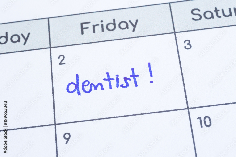 The word Dentist written on calendar page. The word Dentist written on calendar page.