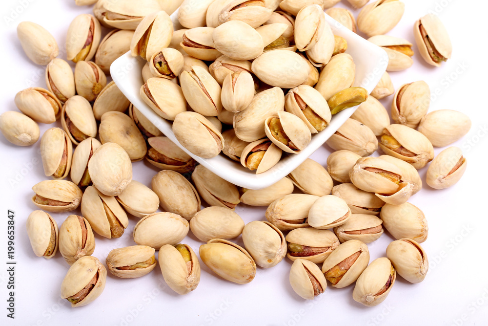 Unshelled roasted and salted cashew nuts isolated on white background Unshelled roasted and salted cashew nuts isolated on white background