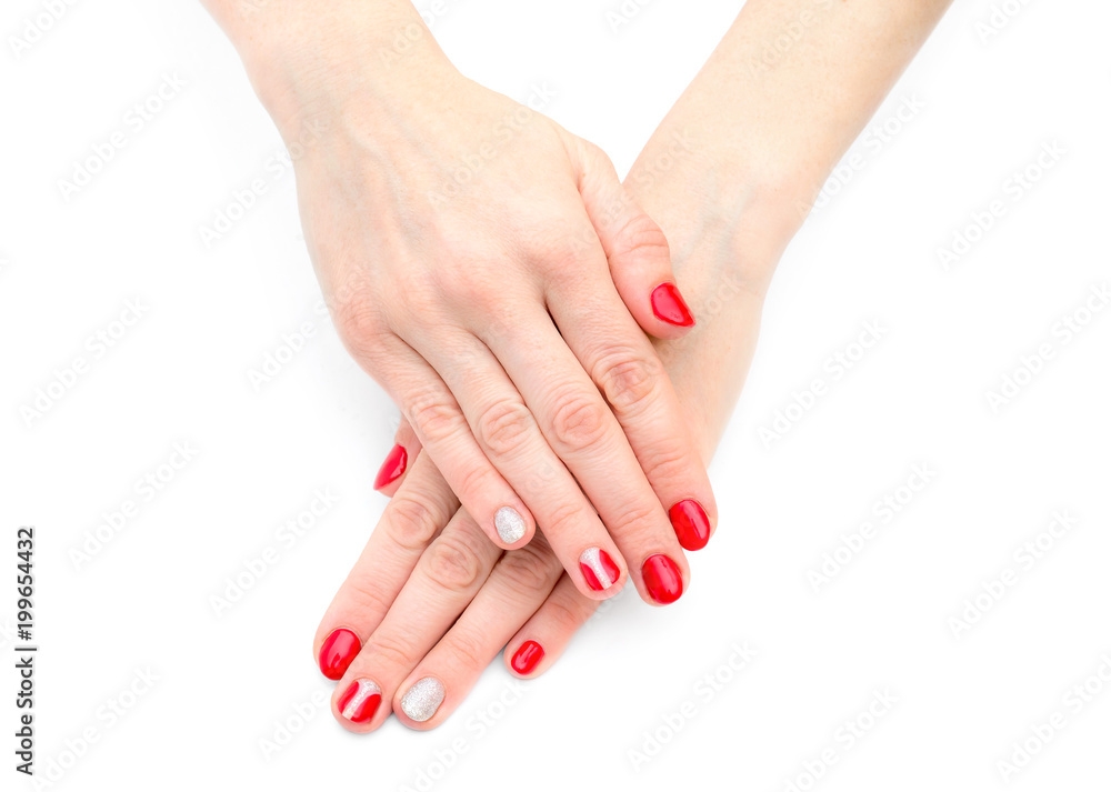 Female's hands with red manicure on white background. Top View. Female's hands with red manicure on white background. Top View.