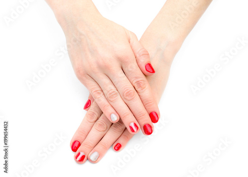 Female's hands with red manicure on white background. Top View.