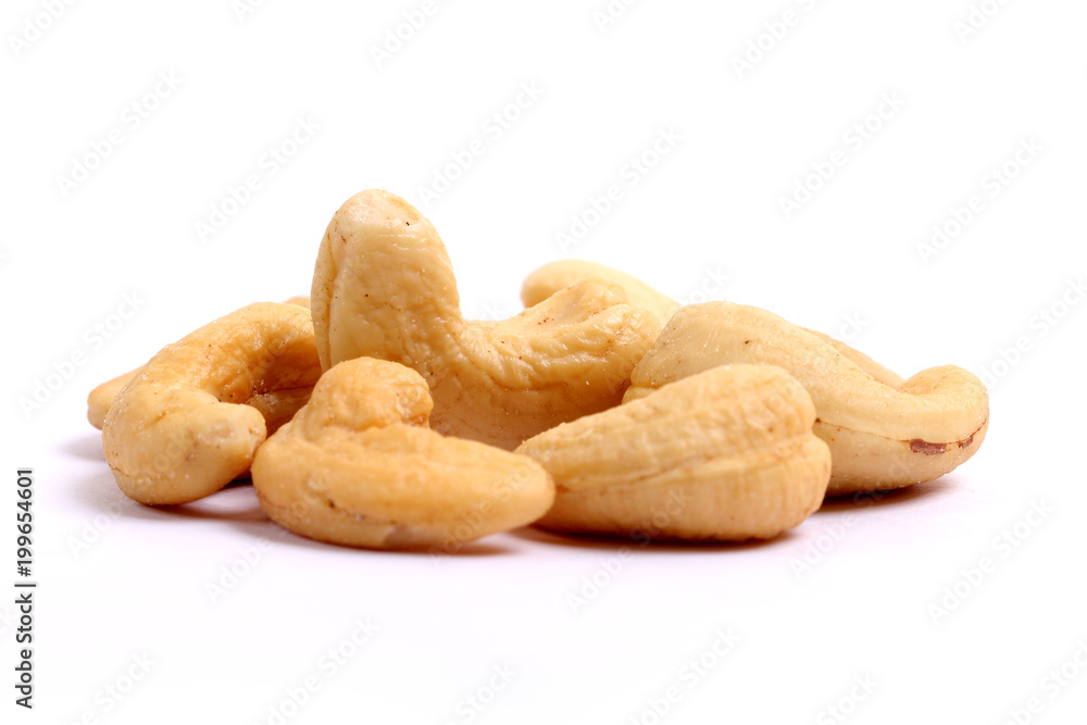 Unshelled roasted and salted cashew nuts isolated on white background Unshelled roasted and salted cashew nuts isolated on white background