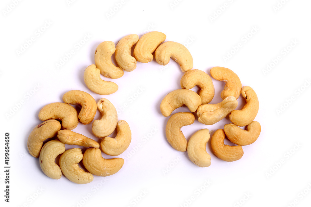Unshelled roasted and salted cashew nuts isolated on white background Unshelled roasted and salted cashew nuts isolated on white background