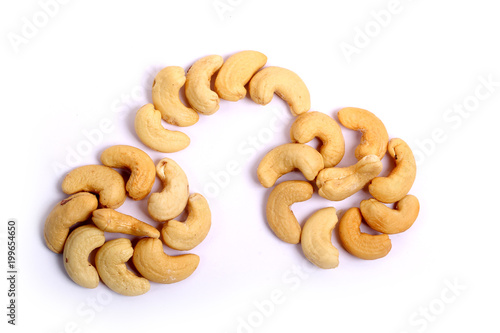 Unshelled roasted and salted cashew nuts isolated on white background