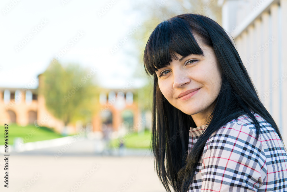 Portrait of beautiful young brunette girl.