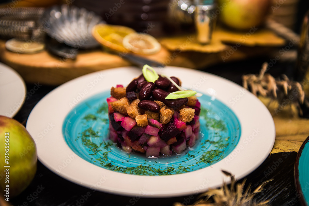 traditional Russian salad with beets, sauerkraut, beans, crackers, onions, cucumbers, potatoes (vinaigrette) traditional Russian salad with beets, sauerkraut, beans, crackers, onions, cucumbers, potatoes (vinaigrette)