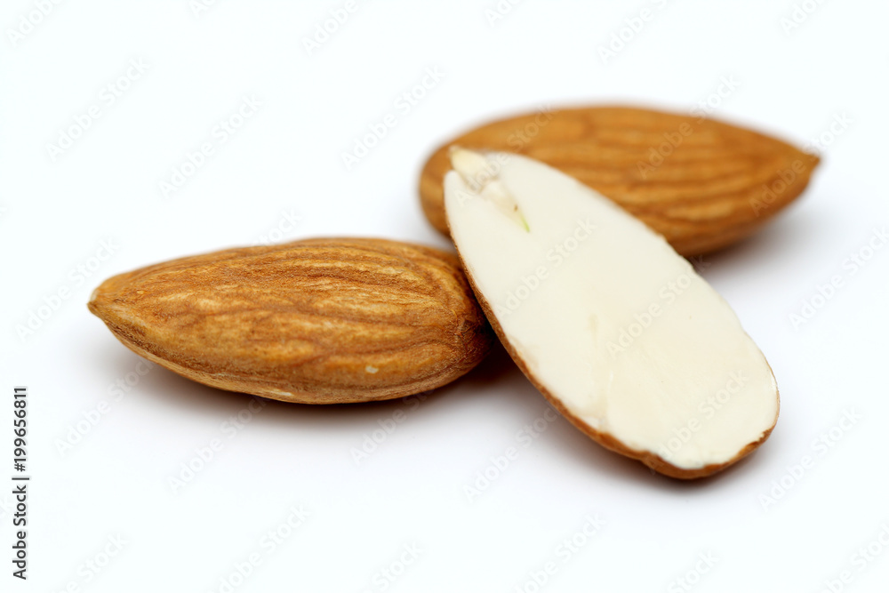Almonds isolated. Group of almond nuts isolated on white background. Full depth of field Almonds isolated. Group of almond nuts isolated on white background. Full depth of field