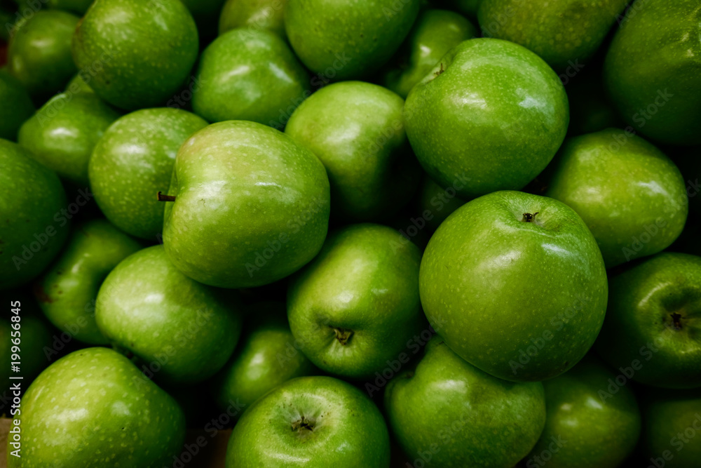 Bright green apples with glare