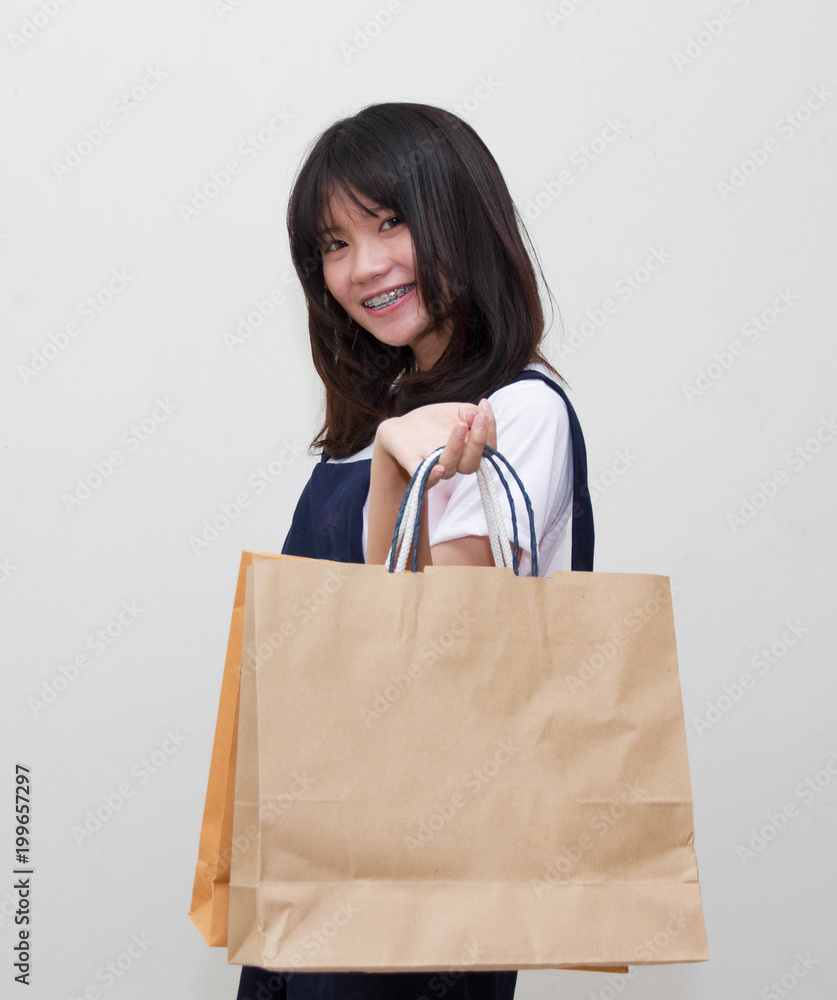 Shopping woman holding bag isolated on white background Shopping woman holding bag isolated on white background