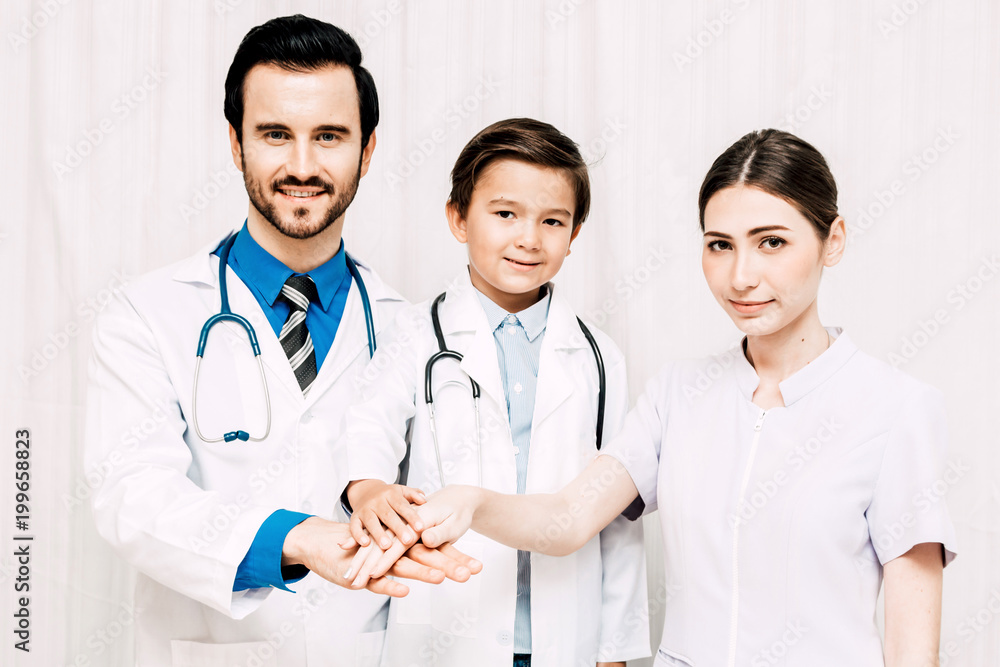 Group of successful doctors and nurses stack hands together at hospital Group of successful doctors and nurses stack hands together at hospital