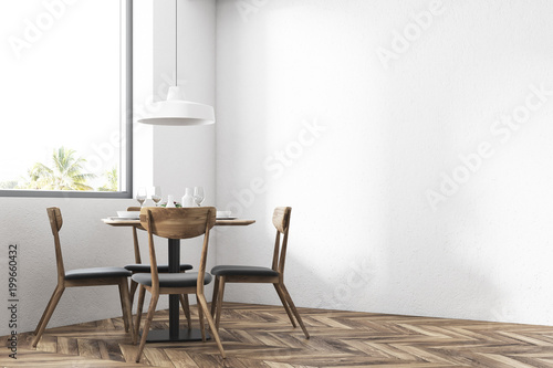 Round table with chairs in a restaurant, window