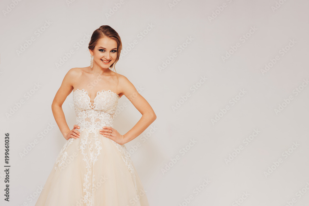 beautiful young bride in a wedding dress demonstrates different poses beautiful young bride in a wedding dress demonstrates different poses