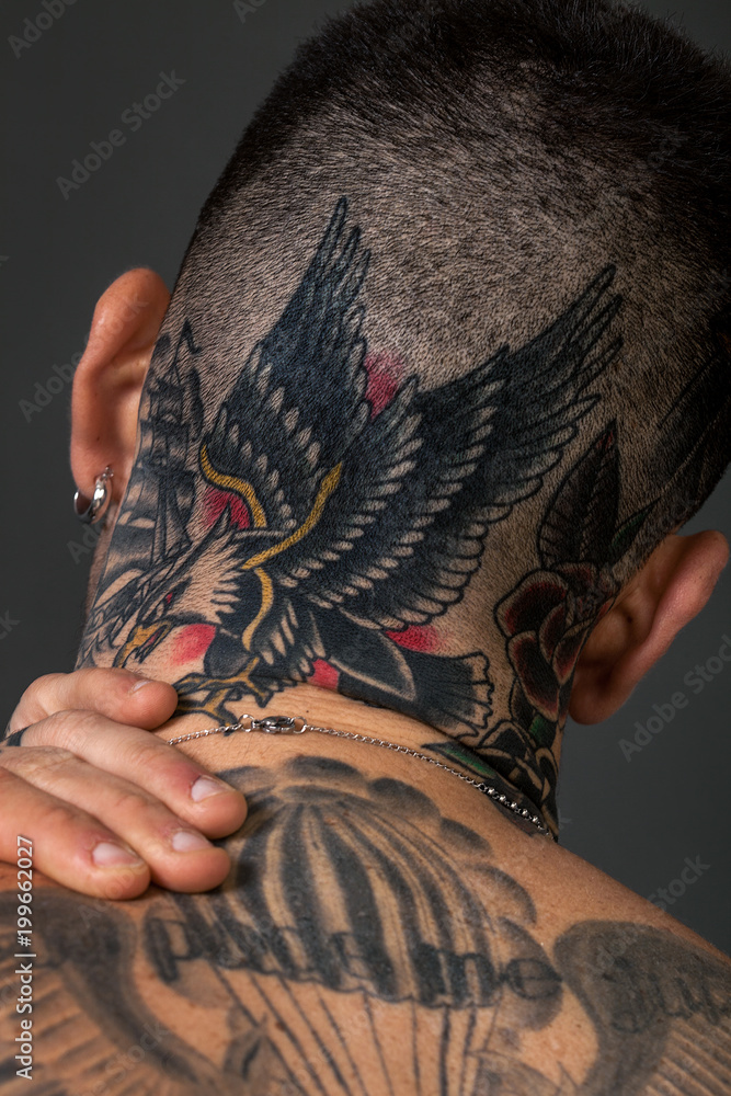 Man back closeup portrait with tattoos on his head and neck Stock Photo |  Adobe Stock