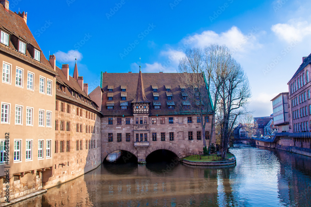 View of the Heilig-Geist-Spital (Hospice of the Holy Spirit) in the old Town of Nuremberg, Germany.