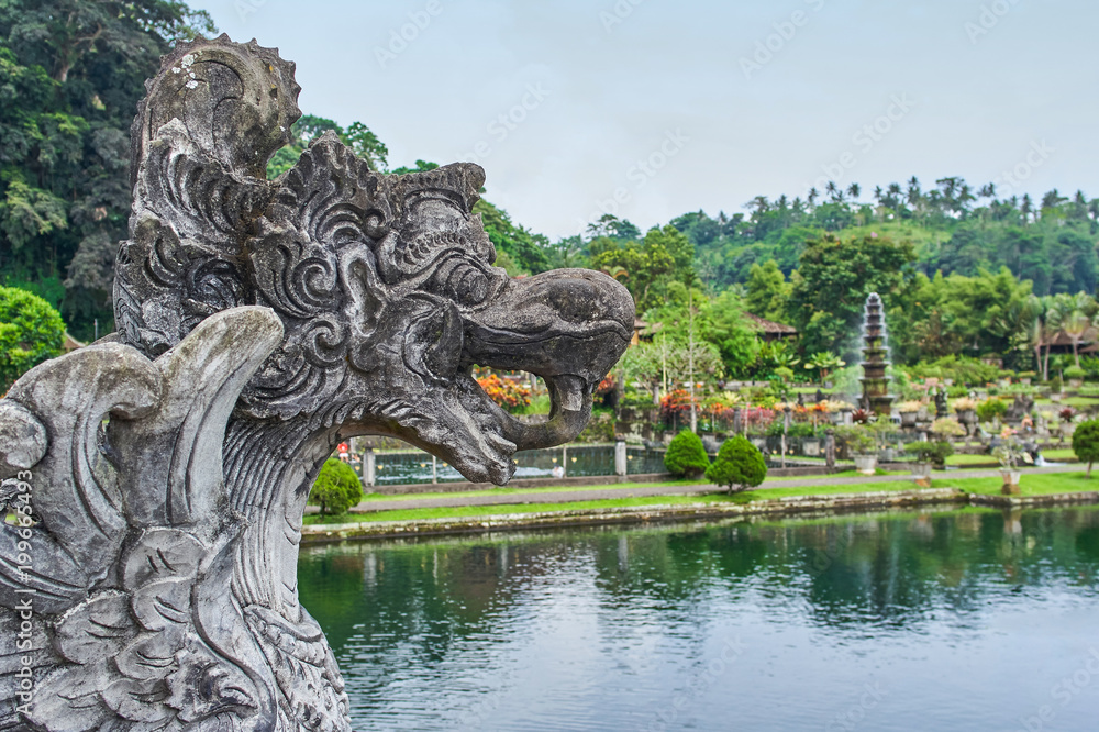 Scary mythology statue in Tirta Gangga water palace on Bali island, Indonesia Scary mythology statue in Tirta Gangga water palace on Bali island, Indonesia