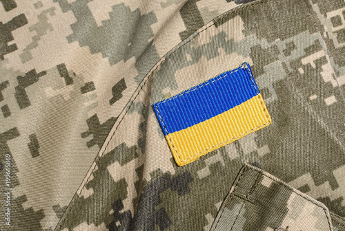 Military uniform with Ukrainian flag patch photo