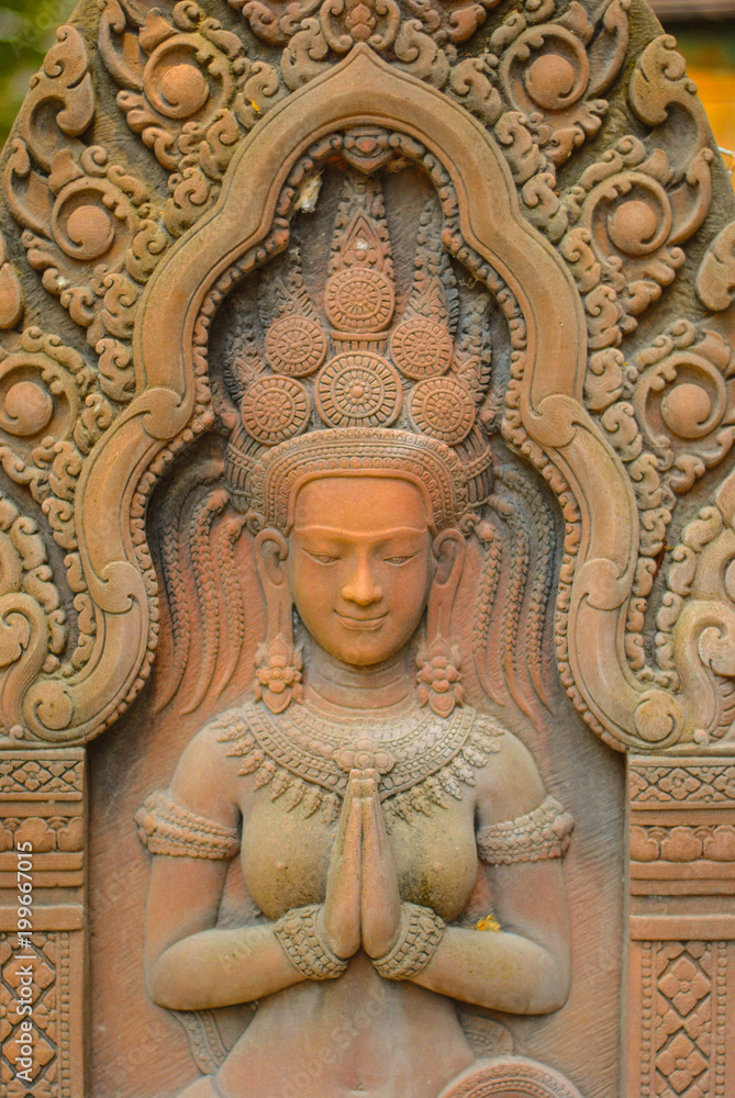 Fototapeta premium Stone carving Stucco Women Antiques based on the Hindu belief. In ancient Cambodia, Thailand, Indonesia and Laos.