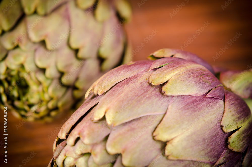 Fototapeta premium Italian artichokes on wooden plane