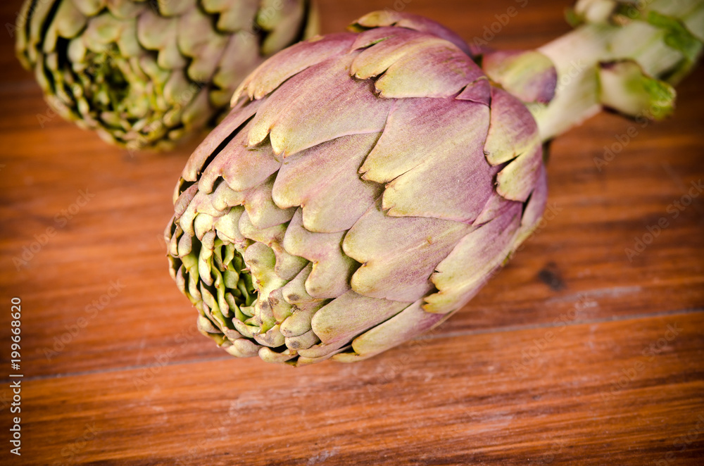Fototapeta premium Italian artichokes on wooden plane