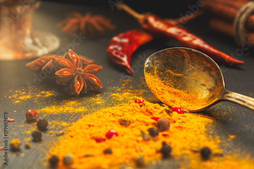 Fototapeta Naklejka Na Ścianę i Meble -  Wooden table of colorful spices