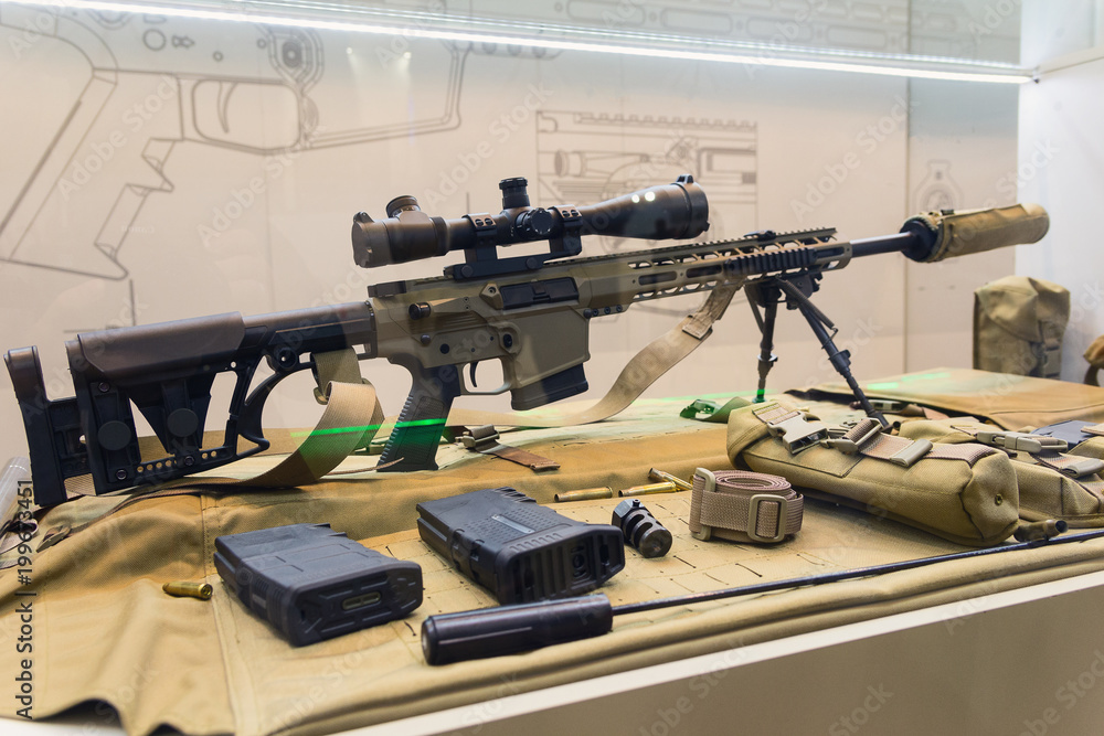 Sniper rifle and accessories on the counter of the store. Weapons - obrazy, fototapety, plakaty 