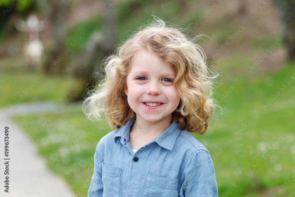 Happy child with long blond hair enjoying the nature Happy child with long blond hair enjoying the nature