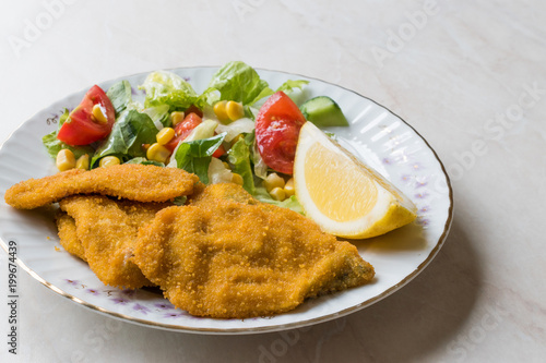 Fried Crispy Sardine Fish Plate with Salad and Lemon / Seafood Sardalya