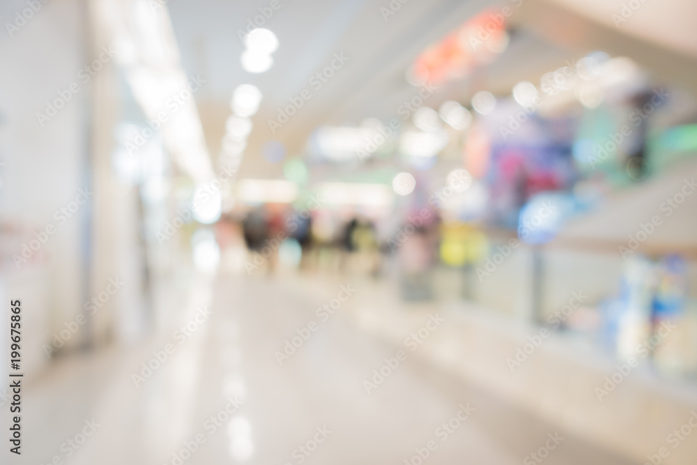 shopping mall blur image background of hall in shopping mall with people