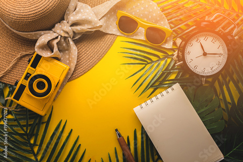 flat lay product display frame border of summer concept with travel stuff camera notebook glasses and woman hat flatlay image on color background with free copy space