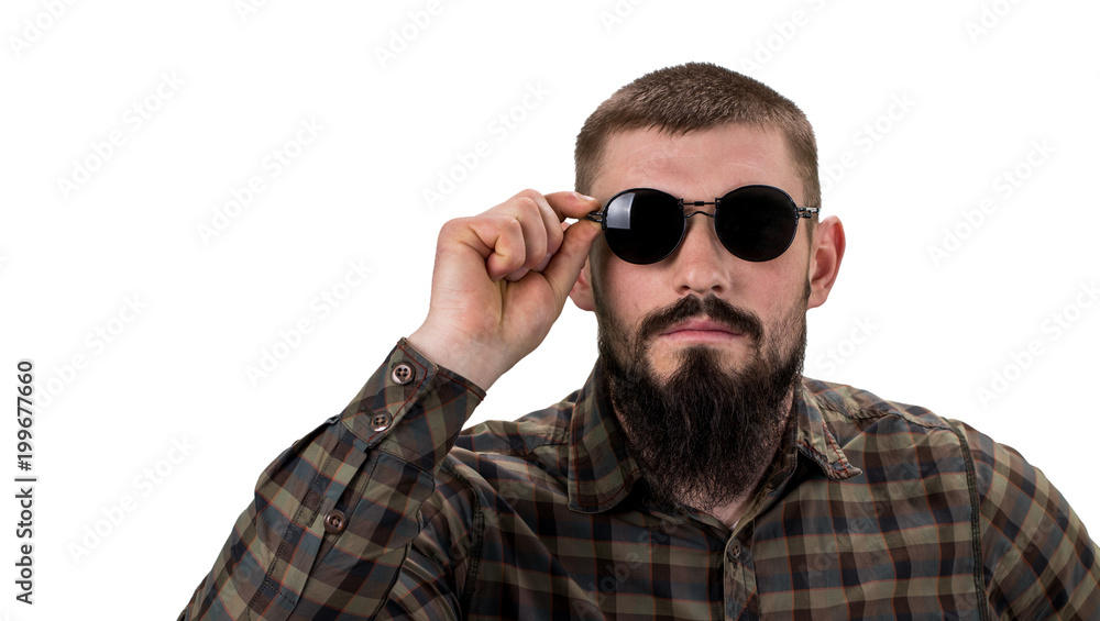 Fototapeta premium closeup portrait of a young casual man in sunglasses looking into the camera on white background