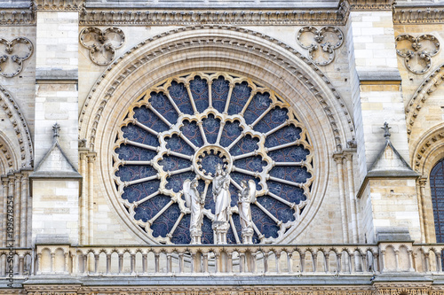 Stained glass window in facade of Notre dame cathedral. North Rose window at Notre Dame cathedral dates from 1250 and is also 12.9 meters in diameter. Its main theme is the Old Testament