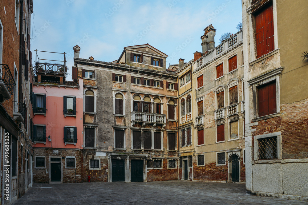 Old buildings in a piazza within Venice, Italy.