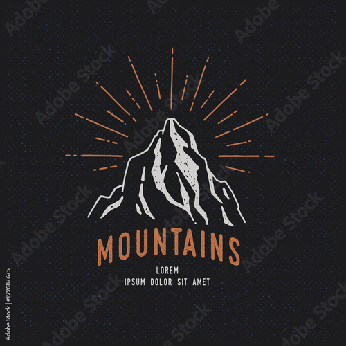 Hand Drawn mountains. Sketch illustration. Adventure logo isolated on dark background. Vintage trendy label.