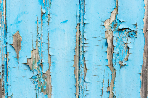 Tableau sur toile Blue paint flaking off wooden panel background