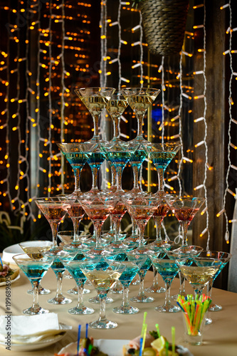 Pyramid of glasses with cocktails at the furshet