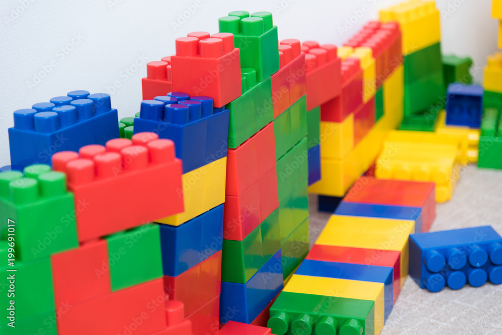 Obraz premium The colored bricks of the designer are lying on the floor