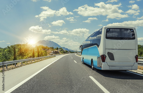 Bus rushes along the asphalt high-speed highway. © Denis Rozhnovsky