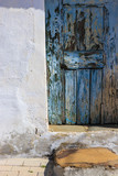 Detail from a old rustic blue door from a traditional house in Alentejo Portugal