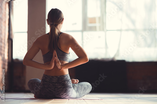 Young instructor in a yoga class