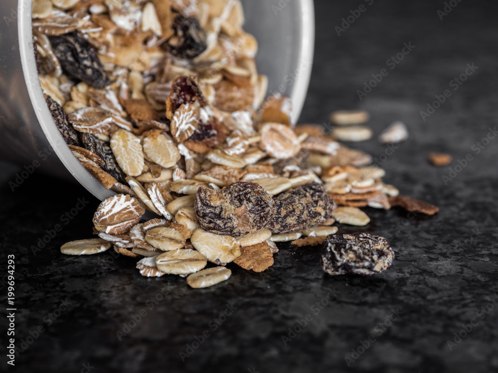 Close up shot of musli coming out of container Close up shot of musli coming out of container