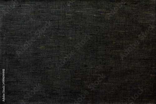 Linen homespun fabric in black color. Background.