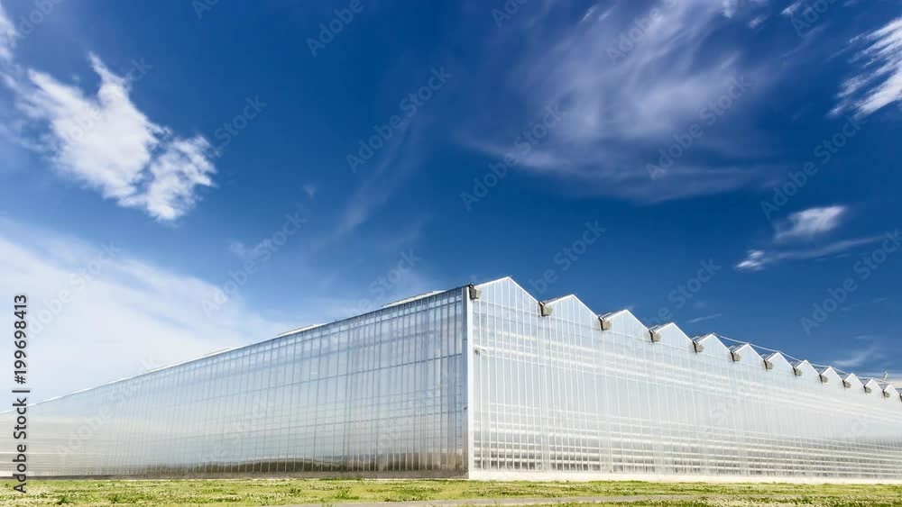 Timelapse of Clouds Moving Ower Greenhouse. Corner View Timelapse of Clouds Moving Ower Greenhouse. Corner View