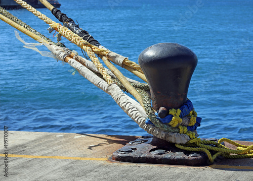 cruise ship mooring lines and attached to pier bollard, Lesser Antillies, Caribbean photo