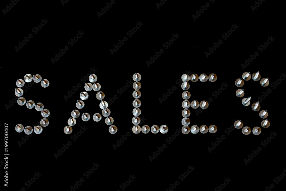 Word sales lined with screws letters on black background. Sales creative concept in 3D metal font close-up for hardware store. Mockup for shopping, sales, black friday, copy space. Word sales lined with screws letters on black background. Sales creative concept in 3D metal font close-up for hardware store. Mockup for shopping, sales, black friday, copy space.