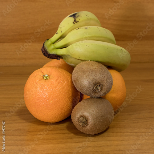 Fruits composition with bananas oranges and kiwi