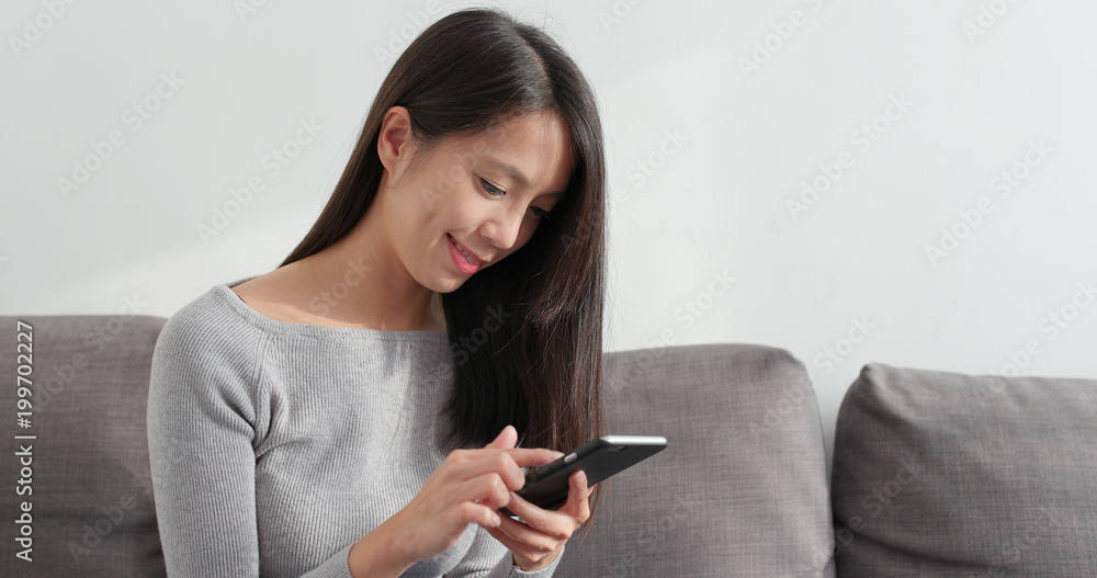 Woman looking at mobile phone Woman looking at mobile phone
