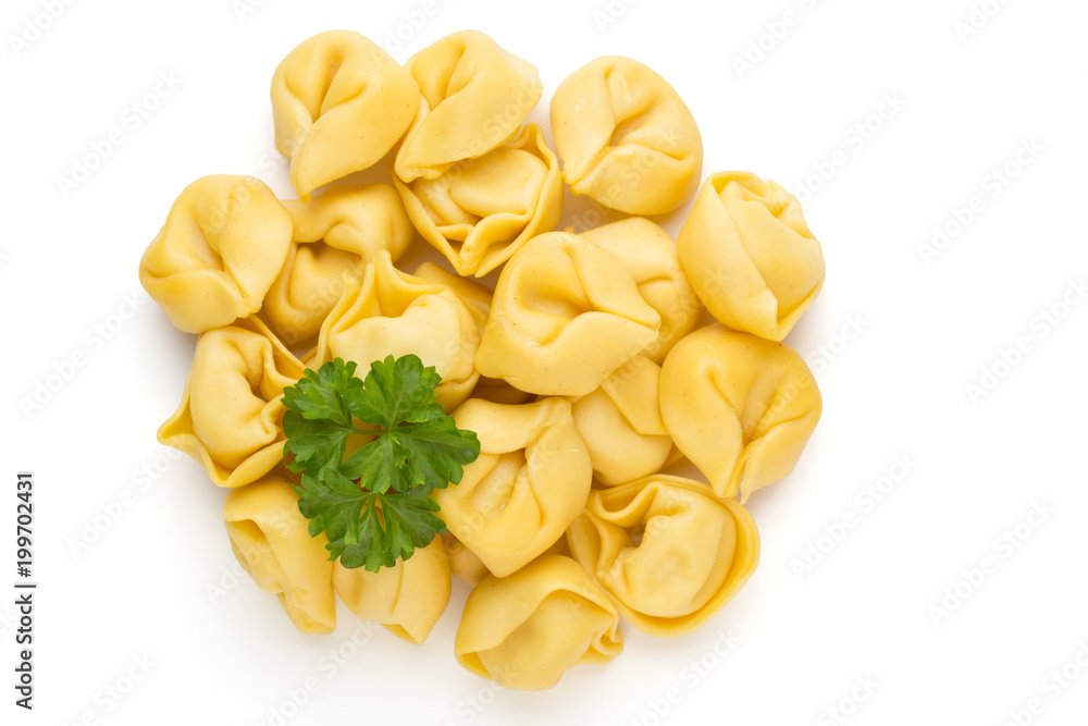 Raw homemade pasta,tortellini with herbs. Raw homemade pasta,tortellini with herbs.