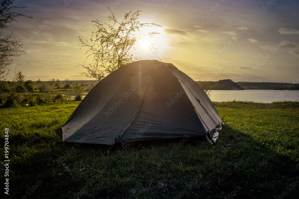 Tourist tent camping on the river bank. Southern Bug. Ukraine