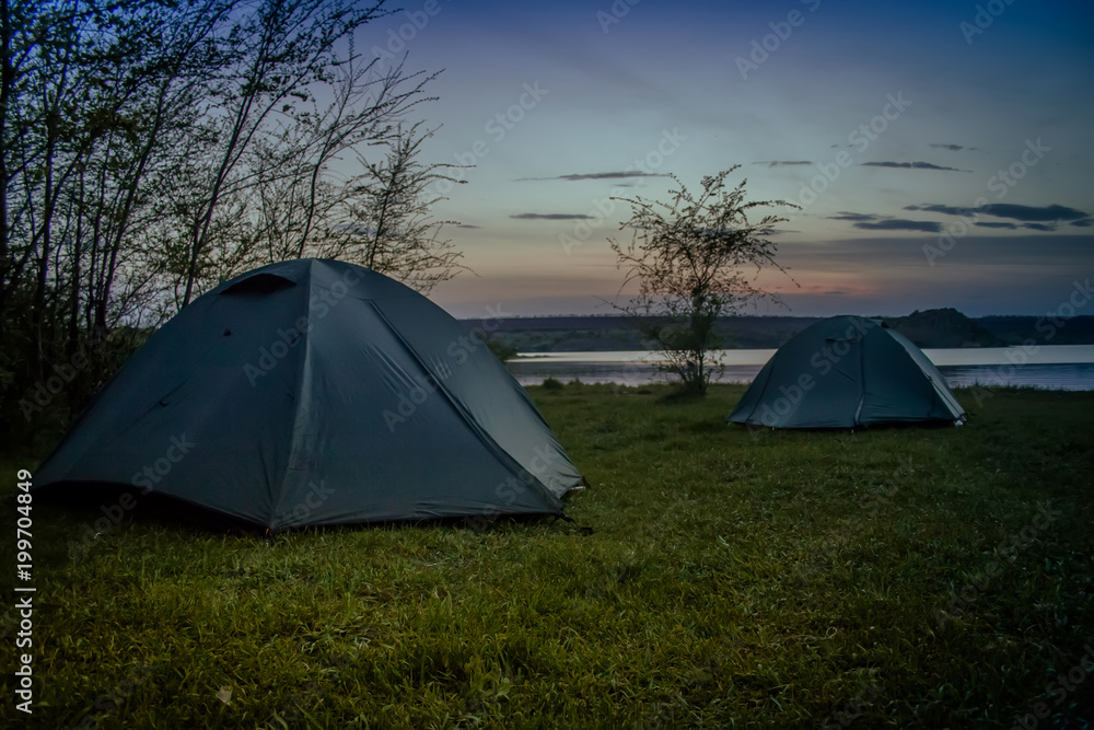 Tourist tent camping on the river bank. Southern Bug. Ukraine