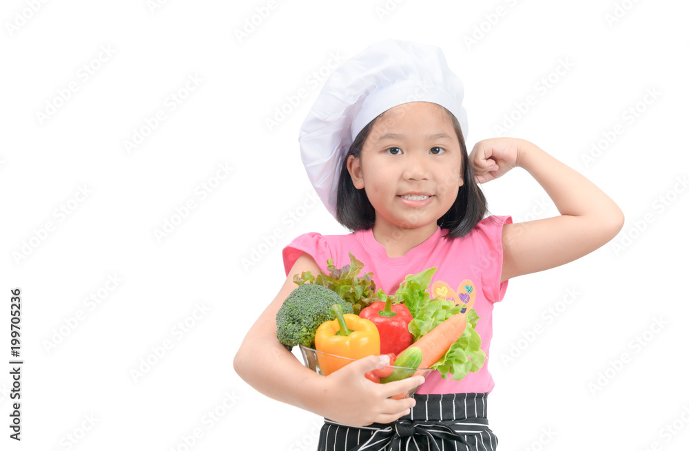 Little chef holding vegetables and show muscle Little chef holding vegetables and show muscle